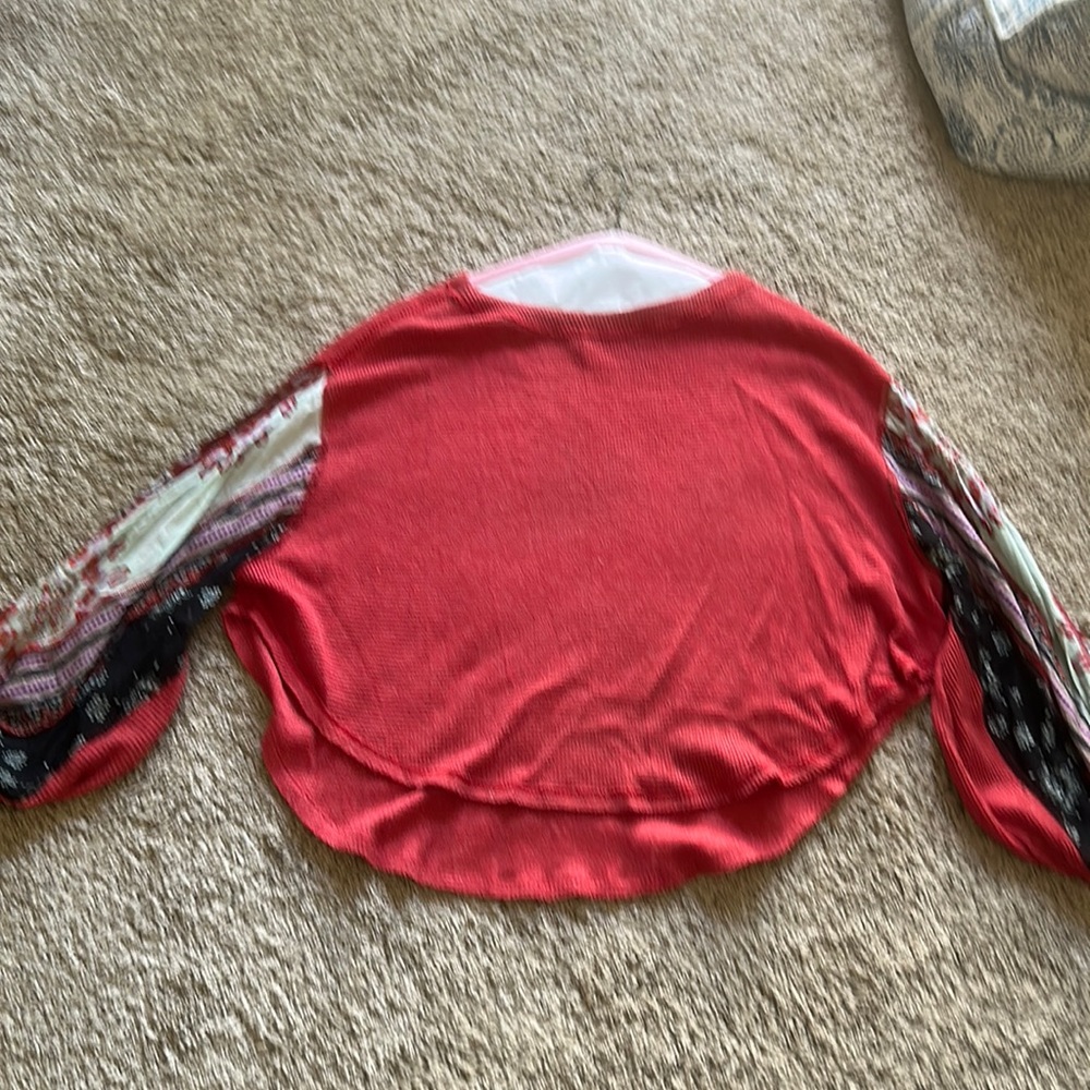 Women’s size medium top. We the free brand. Balloon sleeves